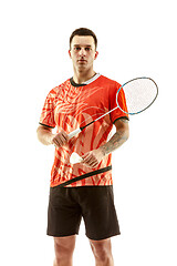 Image showing Young male badminton player over white background