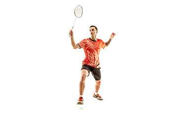 Image showing Young male badminton player over white background