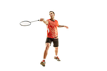 Image showing Young male badminton player over white background