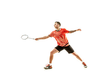 Image showing Young male badminton player over white background