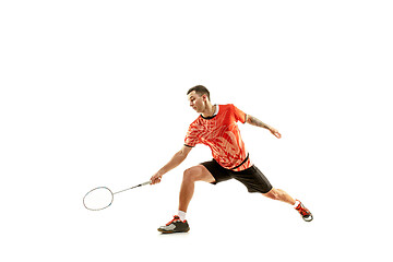 Image showing Young male badminton player over white background