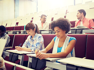 Image showing group of students with notebooks at lecture hall