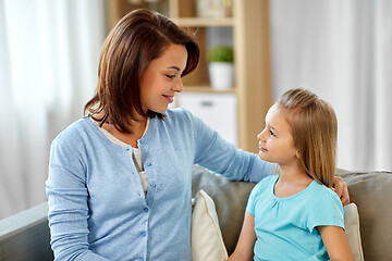 Image showing mother and daughter looking at each other at home