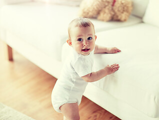 Image showing happy little baby boy or girl at home