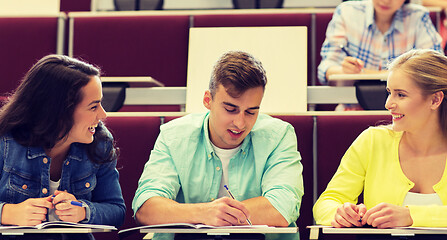 Image showing group of students with notebooks in lecture hall