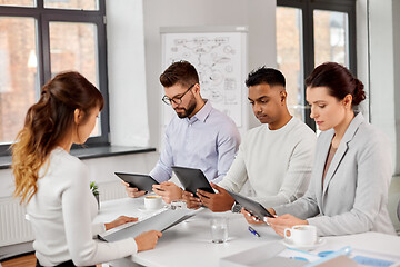 Image showing team of recruiters with tablet pc at job interview