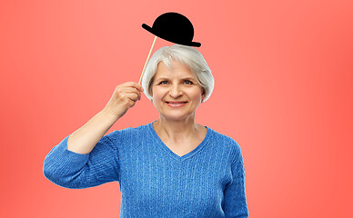 Image showing funny senior woman with vintage party hat