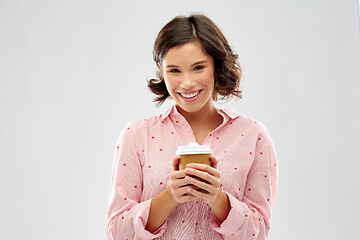 Image showing happy young woman in pajama with cup of coffee