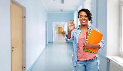 Image showing african american student woman with notebooks