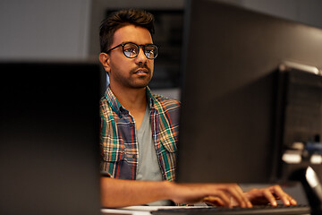 Image showing close up of creative man working at night office