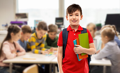 Image showing smiling student boy with books and school bag