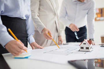 Image showing close up of architects discussing house project