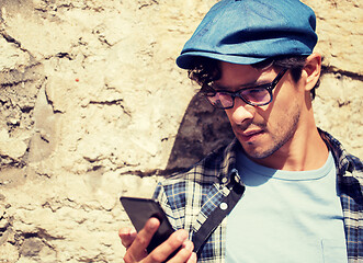 Image showing hipster man texting message on smartphone