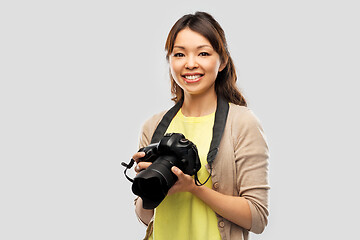 Image showing asian female photographer with digital camera