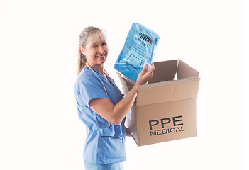Image showing Nurse or doctor holding a Category 3 Coverall PPE for infection 