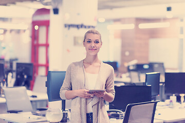 Image showing Business Woman Using Digital Tablet in front of startup Office