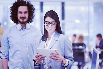 Image showing Business People Working With Tablet in startup office