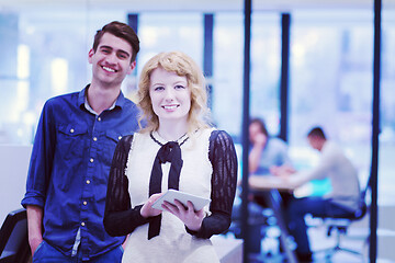 Image showing Business People Working With Tablet in startup office