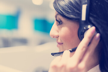 Image showing female call centre operator doing her job