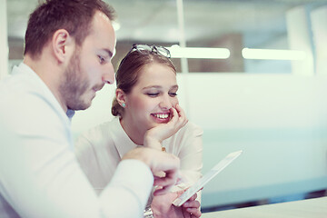 Image showing Business People Working With Tablet in startup office