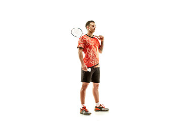 Image showing Young male badminton player over white background