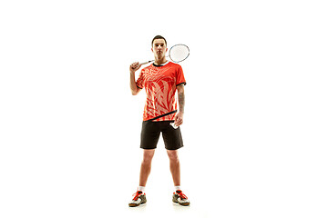 Image showing Young male badminton player over white background