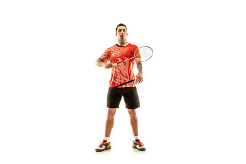 Image showing Young male badminton player over white background