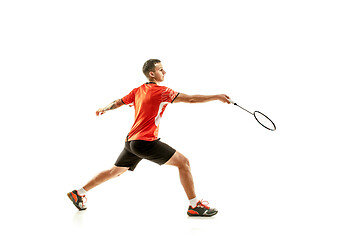 Image showing Young male badminton player over white background