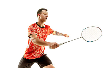 Image showing Young male badminton player over white background