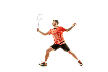 Image showing Young male badminton player over white background