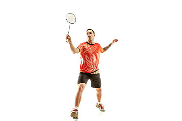 Image showing Young male badminton player over white background