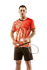 Image showing Young male badminton player over white background