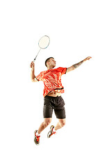 Image showing Young male badminton player over white background