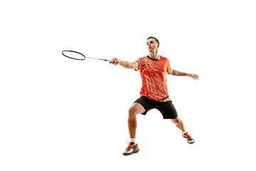 Image showing Young male badminton player over white background