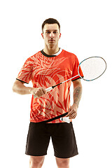 Image showing Young male badminton player over white background