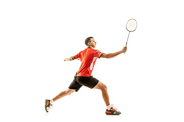 Image showing Young male badminton player over white background