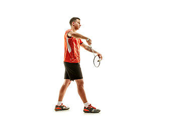 Image showing Young male badminton player over white background