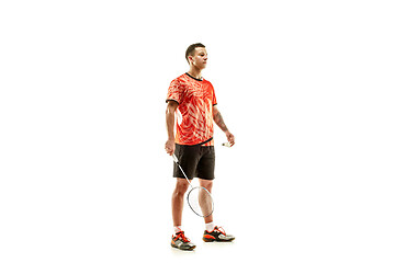 Image showing Young male badminton player over white background