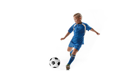 Image showing Young boy with soccer ball doing flying kick