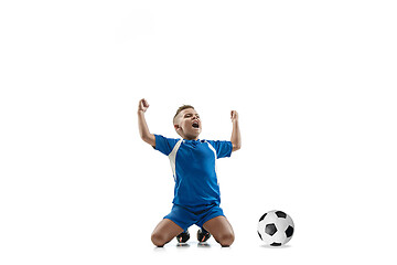 Image showing Young boy with soccer ball doing flying kick