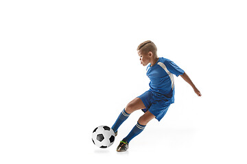 Image showing Young boy with soccer ball doing flying kick