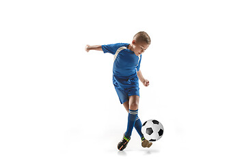 Image showing Young boy with soccer ball doing flying kick