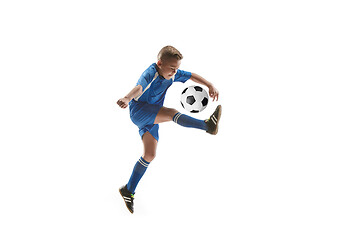 Image showing Young boy with soccer ball doing flying kick