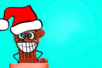 Image showing Cactus hipster man with santa hat. Tropical Christmas concept. Minimal fun art