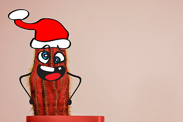 Image showing Cactus hipster man with santa hat. Tropical Christmas concept. Minimal fun art