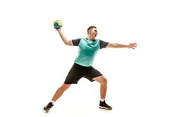 Image showing The one caucasian young man as handball player at studio on white background