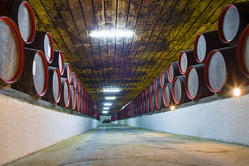 Image showing Underground wine wooden barrels stack