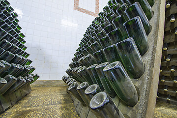 Image showing Wine sparkling bottles on stands