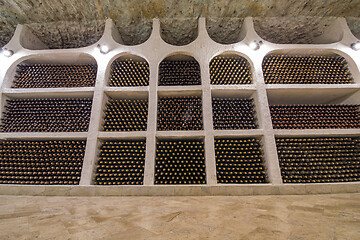 Image showing Wine bottle wall in winery