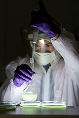 Image showing Scientist working in corona virus vaccine development laboratory research facility.